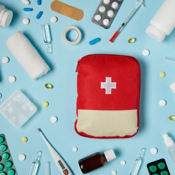first aid kit with pills and bandages