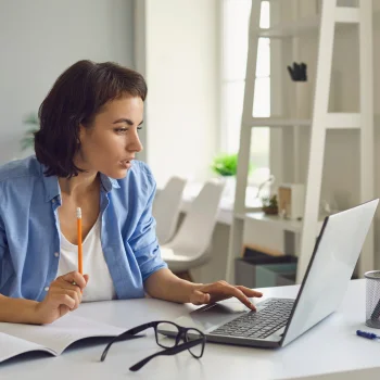 young lady doing online training on her laptop